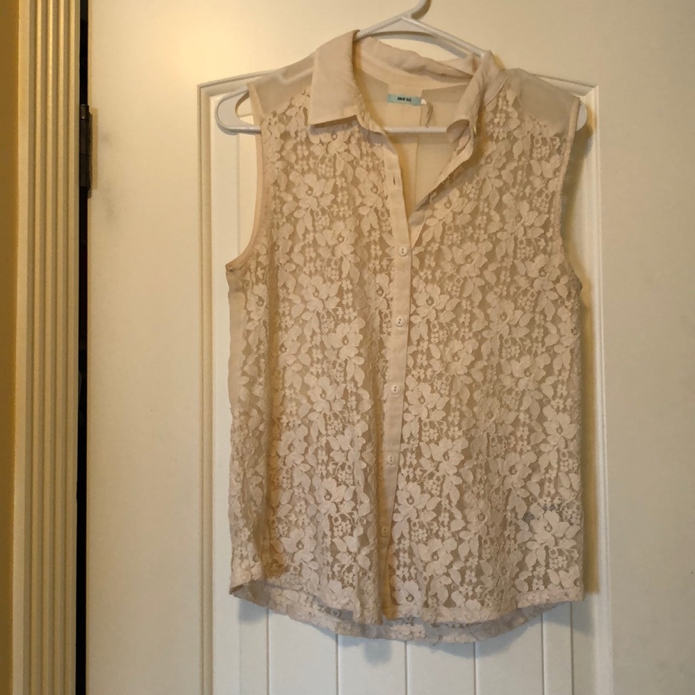 Kimchi blue button down blouse. In cream